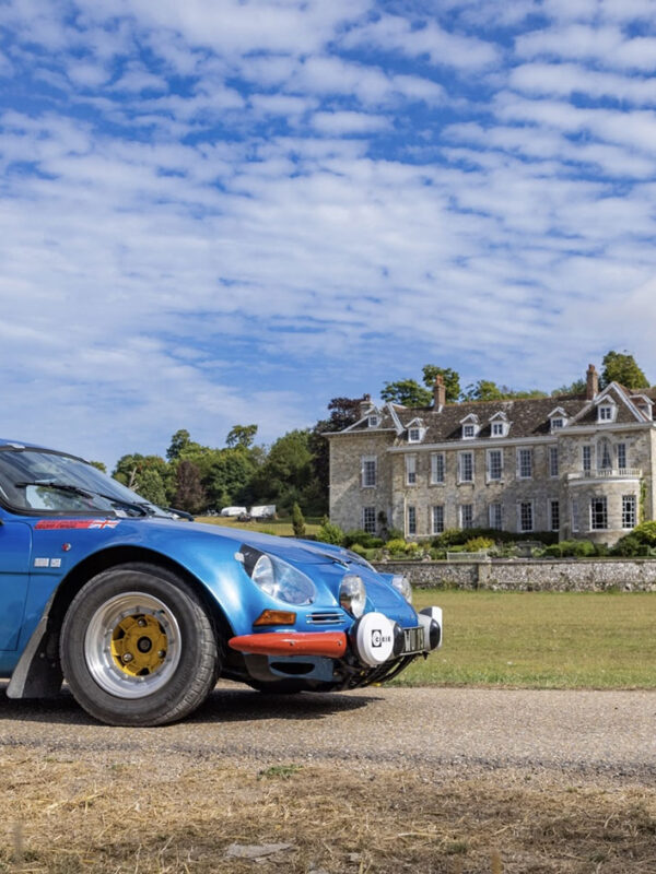Race car at automotive event in front of Firle Place