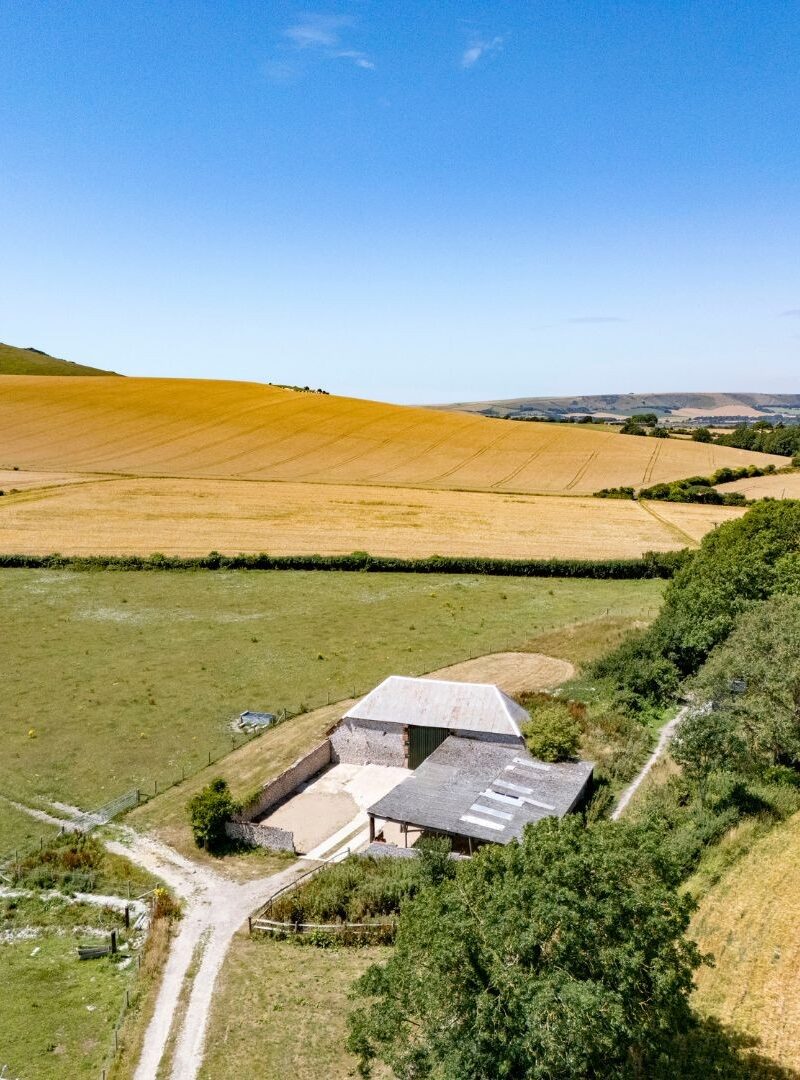 Farming in Firle Landscape with agricultural barns and farm fields