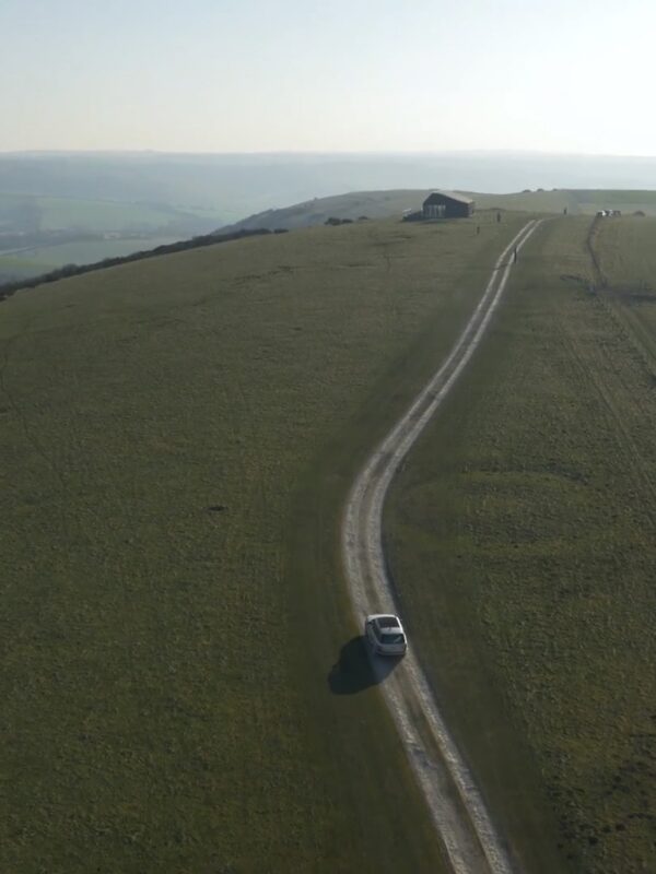 Cars driving on road on Firle Estate