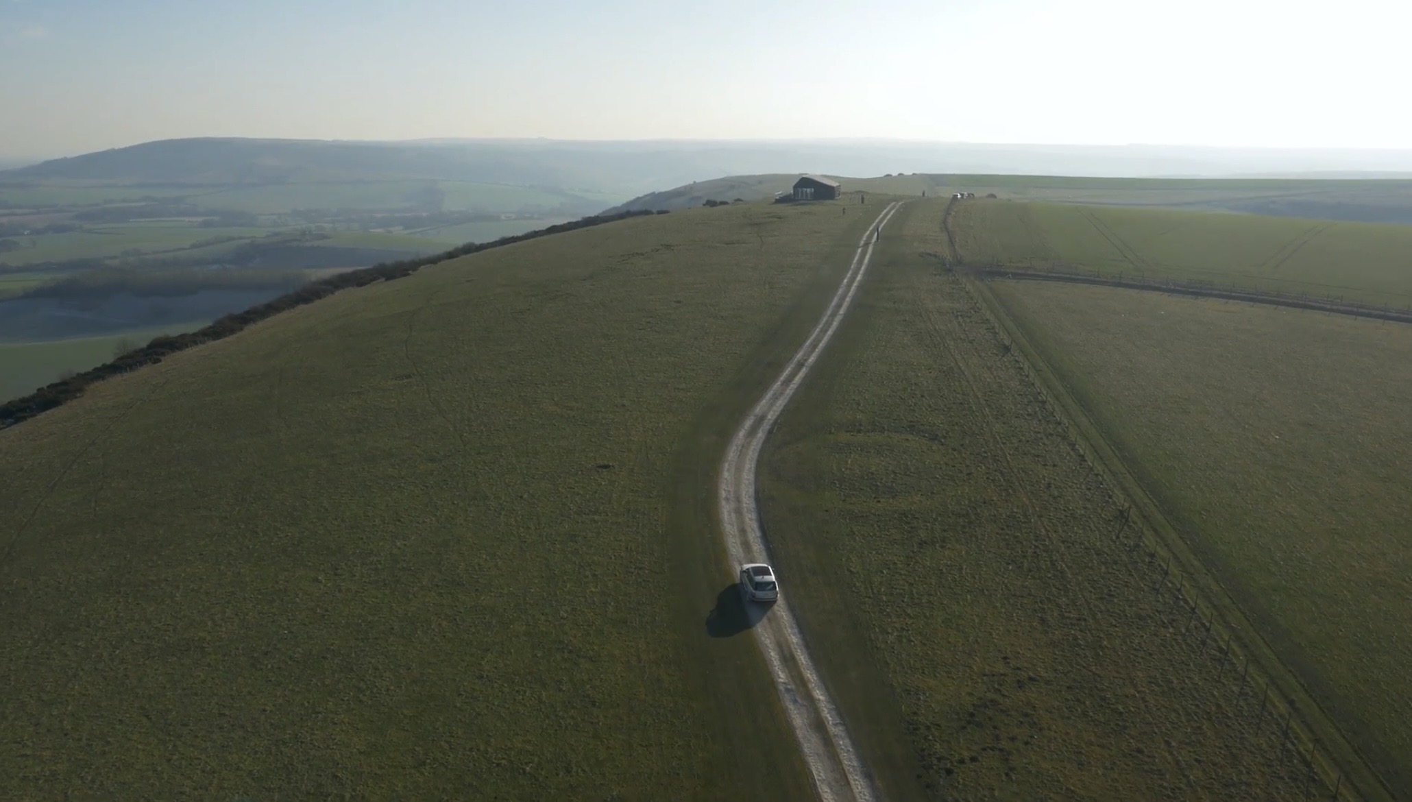 Cars driving on road on Firle Estate