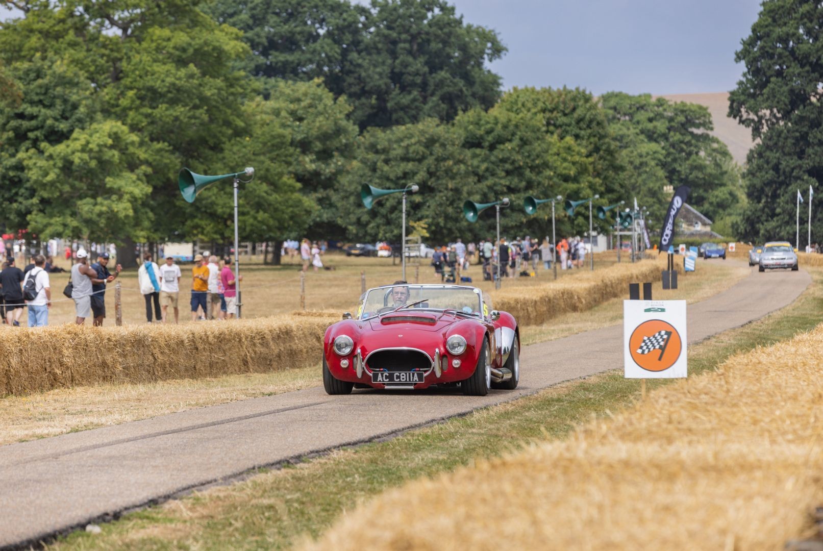 Sports car driving at event at Firle Place